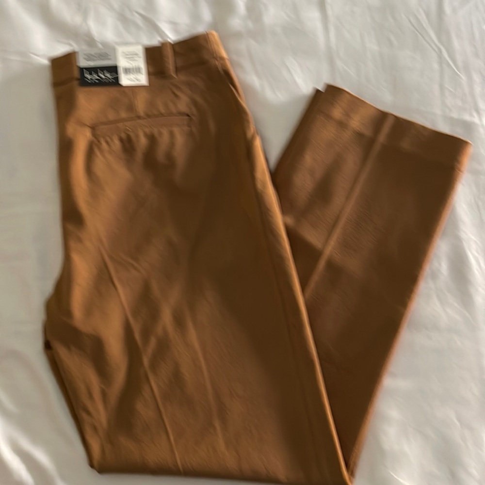 Nicole miller woman’s ankle length pants in caramel color size 10. NWT.